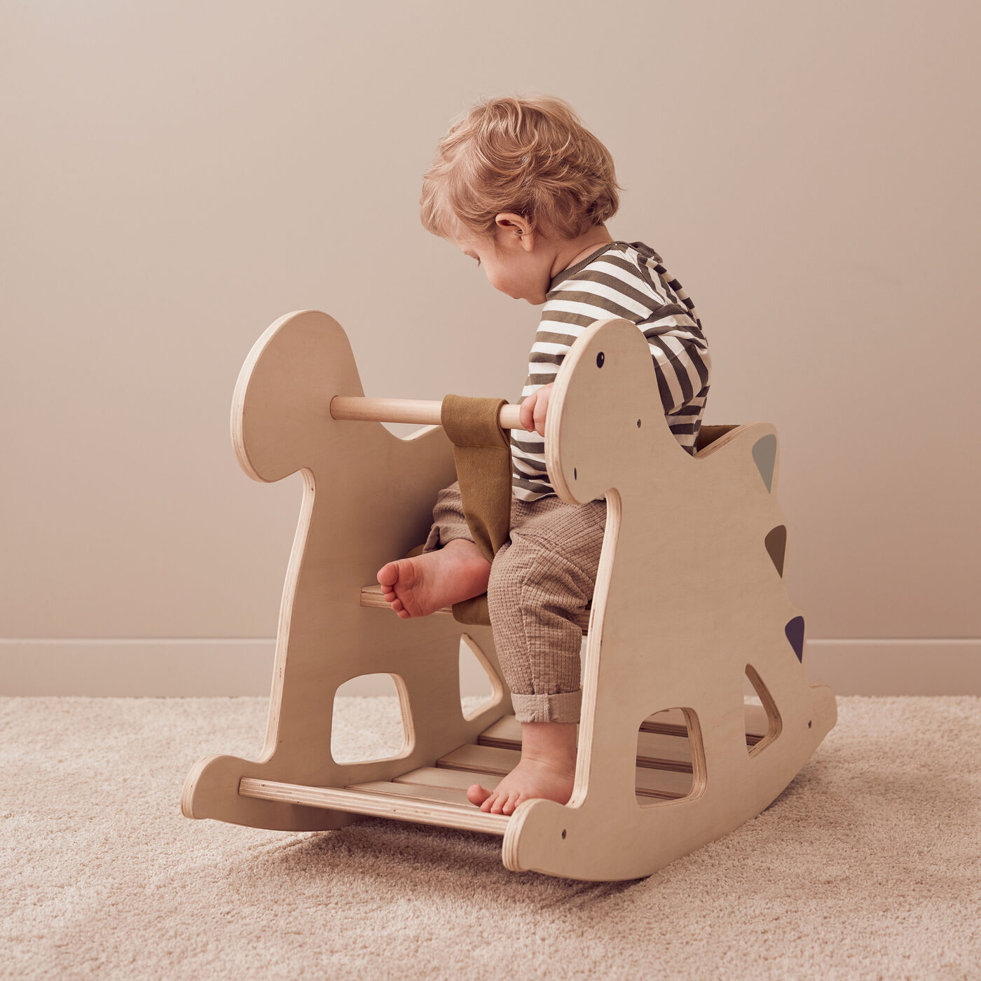 Baby sit in store rocking horse